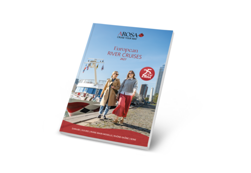 A catalogue cover showing two women walking along a riverbank in front of a boat, with the title ‘European River Cruises 2027’ and a red emblem